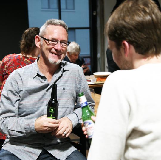 Man drinking Kc Kombucha at bar in New Zealand